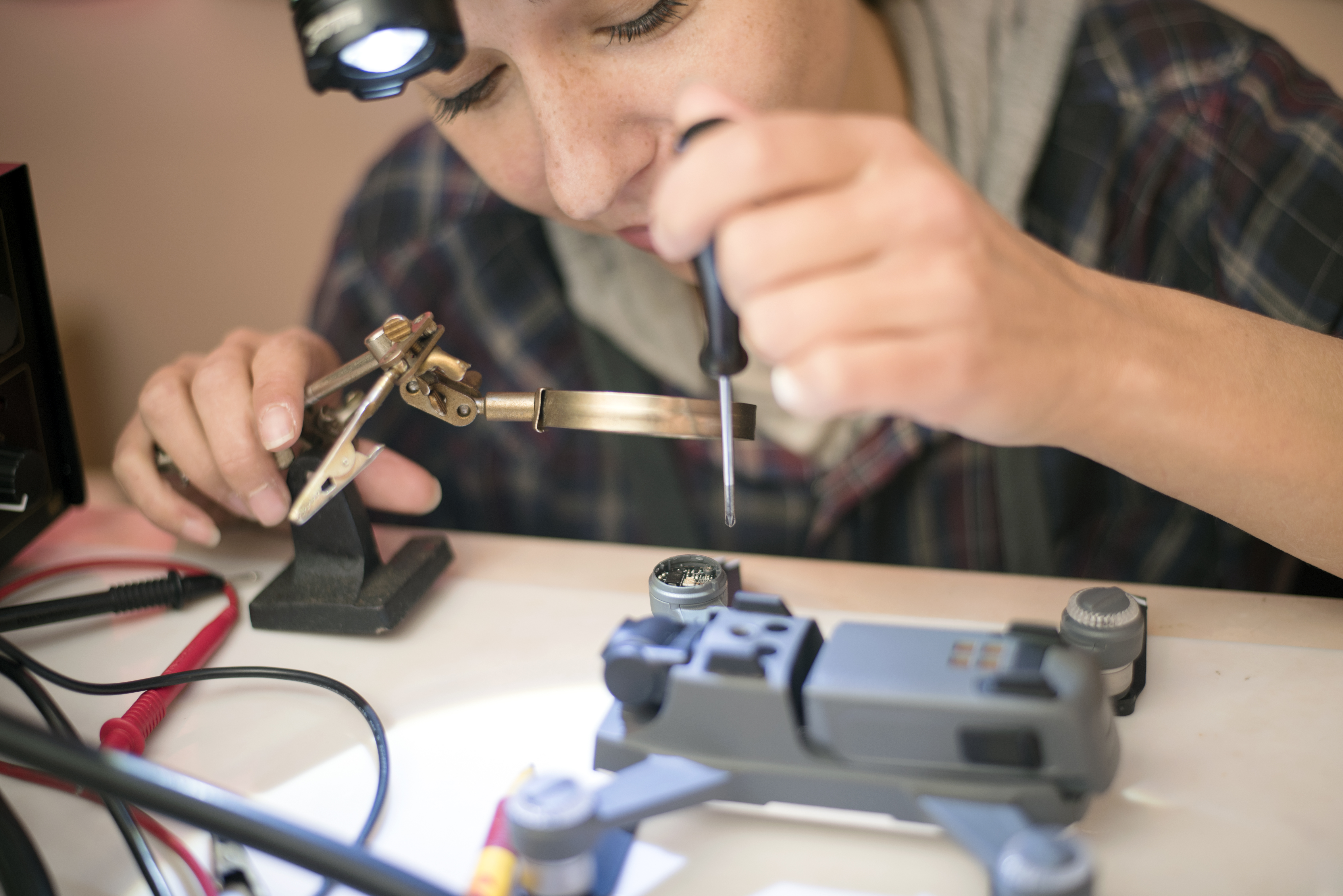 Close up of an engineer fixing a drone.