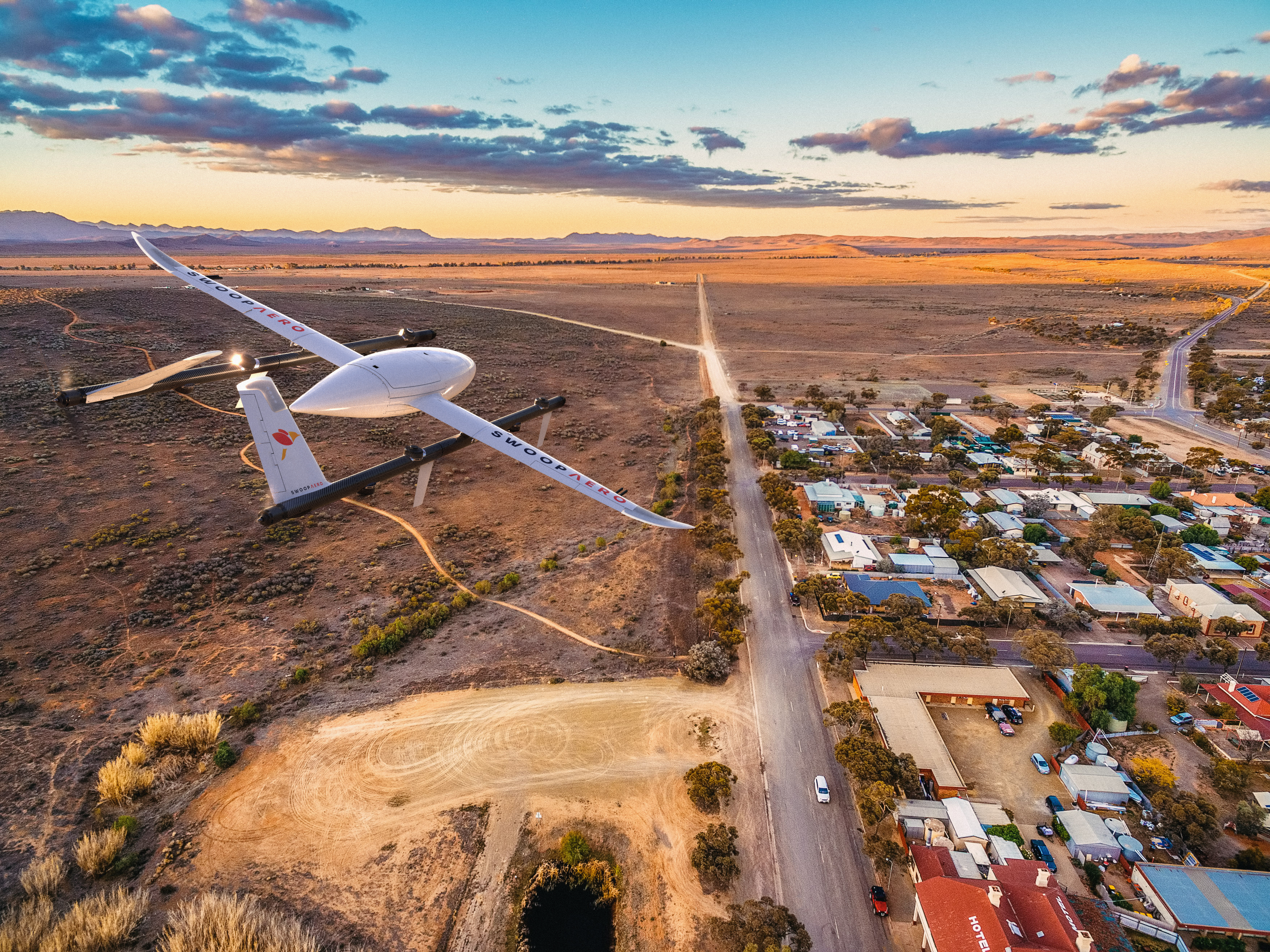 Swoop drone flying over a rural town.